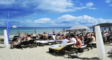 IBIZA, SPAIN – JUNE 16: Sunbathers in the popular Platja den Bos