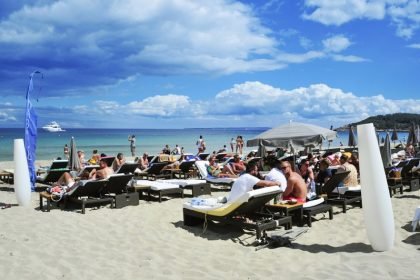 IBIZA, SPAIN – JUNE 16: Sunbathers in the popular Platja den Bos